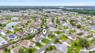 Aerial view of residential area with a nearby body of water