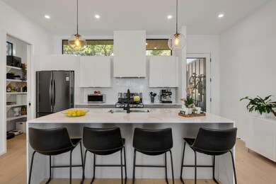 Kitchen featuring freestanding refrigerator, whit