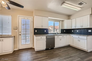 Kitchen featuring stainless steel dishwasher, ceil