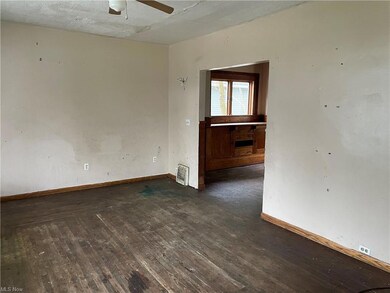 Hardwood floors throughout the living room, dining
