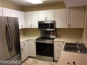 Kitchen featuring appliances with stainless steel 