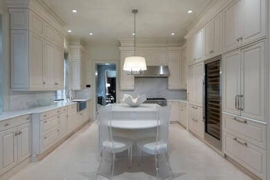 Chef's kitchen with eating table for 2 at the end 