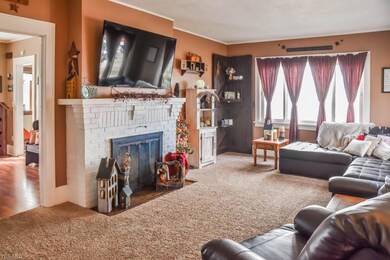Spacious living room with a fireplace and large wi