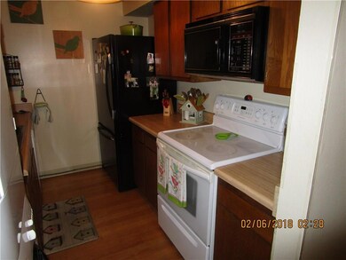 KITCHEN WITH RANGE/OVEN, MICROWAVE, FRIDGE.