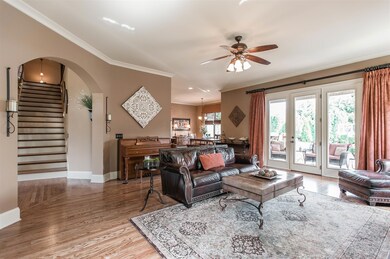 Ultimate open living concept on display. Expanded living areas, coffered and tray ceilings, 2” hardwood planks, pristine millwork, glass doors to picturesque private back yard. 