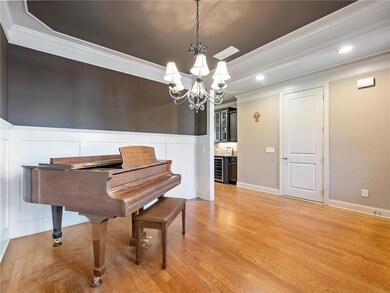 Formal dining room with beverage cooler, light har