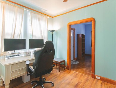 Office/laundry room between the kitchen and primar