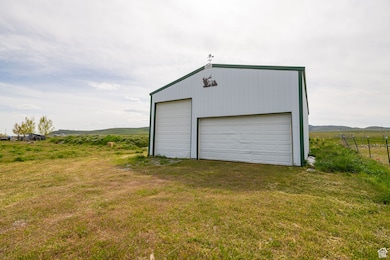 Detached garage featuring a view of countryside