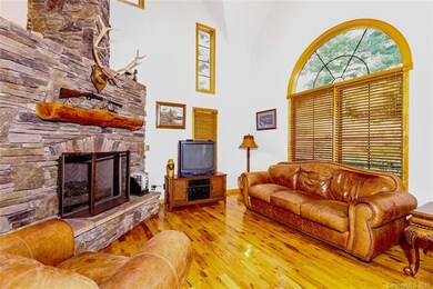 Great Room with Rock Fireplace, hardwood floors, a