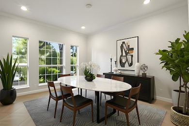 Dining space featuring light tile patterned floor