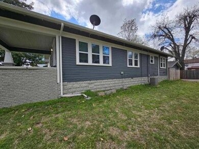 View of side of property featuring central AC and 