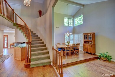 Dramatic staircase, 2 story entry, new engineered wood floors
