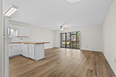 Kitchen with wooden counters, light wood-style flo