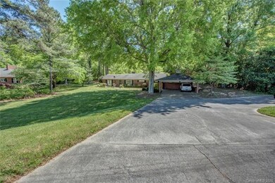 The driveway is not quite as steep as it looks in this photo. However there is a TON of parking spaces. Basketball hoop is in the turn around and stays with the home.
