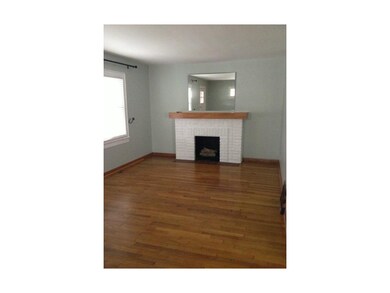 Simple elegant fireplace in large living room
