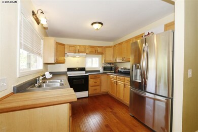 Kitchen features wood flooring, lots of counter sp