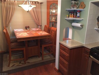 Dining area features built-in cabinets.