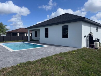 View of pool with a fenced in pool, a yard, fence,