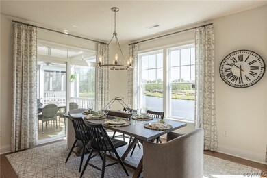 Dining space with dark hardwood / wood-style floor