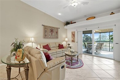 Living room featuring light tile patterned floors, crown molding, recessed lighting, and a ceiling fan
