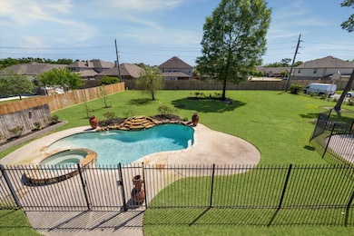 Pool with safety fence on huge lot!