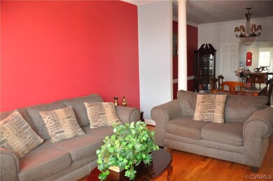 Living room flows to formal dining.