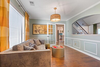 Sitting room with hardwood / wood-style floors, a 
