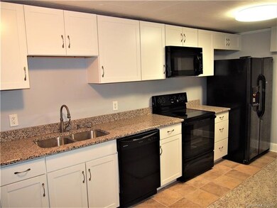 Kitchen with new granite counter tops and applianc