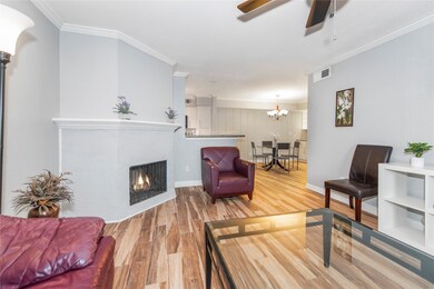 Living room looking toward kitchen and dining area