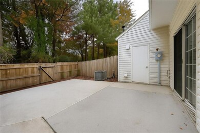 View of patio featuring a gate
