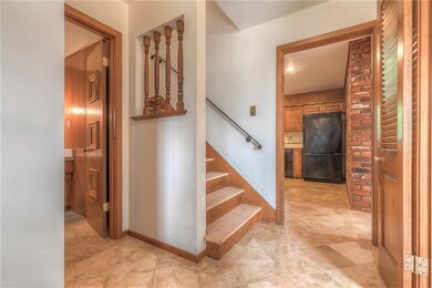 Notice the beautiful travertine tile upon entering