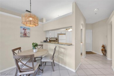 Dining area with ornamental molding, light tile pa