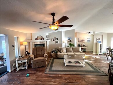 Living room looking toward entry- note gas firepla