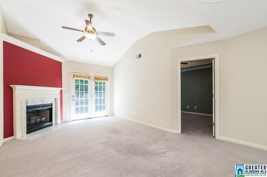 BOASTS a corner fireplace, high ceilings, and acce