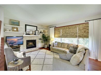Living room with stacked stone surround and custom