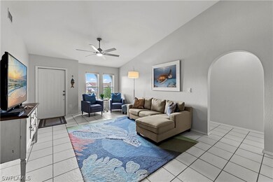 Living room featuring ceiling fan, lofted ceiling,