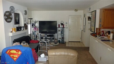 FIREPLACE IS BEHIND COUCH ON LEFT WALL