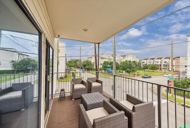 Spacious balcony with comfortable outdoor seating,