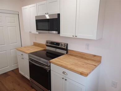 Kitchen with stainless steel appliances, butcher 