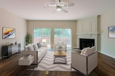 Living room featuring baseboards, a ceiling fan, w