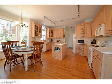 Kitchen. Tons of Cabinets with pull out shelving and island makes for great workspace