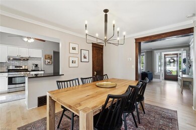 A large pocket door guides you to the dining room with stunning original millwork and built-ins.