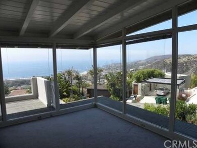 LARGE WINDOWS WITH OCEAN AND SUNSET VIEWS