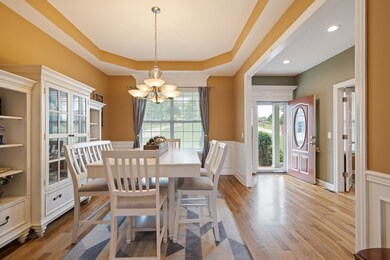 Formal dining with trey ceilings and wainscoting for elegant touch.