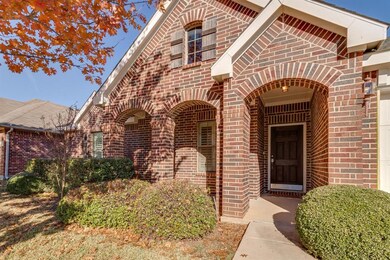 Charming Single Story Brick Home with Large Covere