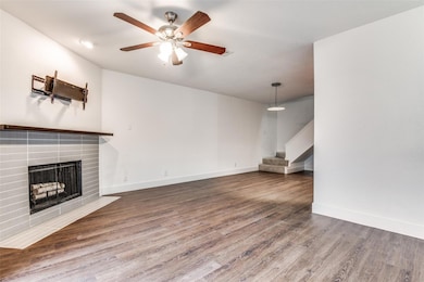 Unfurnished living room featuring a fireplace with