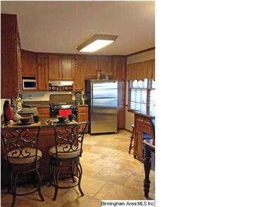 Beautiful kitchen with granite, REAL hardwood custom built cabinets, and upgraded fixtures.