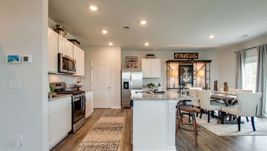 Pictures of another model- The Aisle in Legacy Farms will feature quartz countertops throughout, kitchen backsplash and under cabinet lighting.