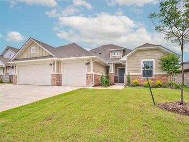 Craftsman house featuring a garage and a front law