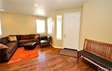 Entryway opens to the living room with hardwood fl